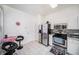 Bright kitchen featuring white cabinets, stainless steel appliances, and a breakfast nook at 18981 Duquesne Dr, Tampa, FL 33647