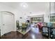 Bright living area with hardwood floors, dining space, and sliding glass doors to outdoor area at 18981 Duquesne Dr, Tampa, FL 33647