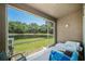 Enclosed patio boasts serene view of green space and pond beyond at 18981 Duquesne Dr, Tampa, FL 33647