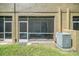 A screened in patio offers a relaxing space with a view to the backyard at 18981 Duquesne Dr, Tampa, FL 33647