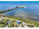 Aerial view of the property showcasing the nearby causeway and pristine waterfront location at 228 Shore Dr, Tarpon Springs, FL 34689