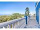 Balcony with patterned tiles and scenic views of the ocean and lush greenery at 228 Shore Dr, Tarpon Springs, FL 34689