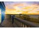 Balcony boasting amazing sunset water views and patterned blue and white tile flooring at 228 Shore Dr, Tarpon Springs, FL 34689