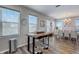 Dining area with bar-style seating and clear view to the formal dining room at 228 Shore Dr, Tarpon Springs, FL 34689