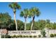 Stone sign for Fred H. Howard Park surrounded by lush greenery, showcasing a welcoming entrance at 228 Shore Dr, Tarpon Springs, FL 34689
