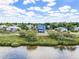 Wide angle exterior showcasing neighborhood and waterfront access at 228 Shore Dr, Tarpon Springs, FL 34689