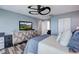 Spacious main bedroom with soft blue walls and contemporary furnishings at 228 Shore Dr, Tarpon Springs, FL 34689