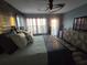 Bright main bedroom with large windows, modern furniture, and stylish decor, creating a relaxing space at 228 Shore Dr, Tarpon Springs, FL 34689