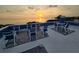 Wide shot of a rooftop deck furnished with ample seating for enjoying the sunset view at 228 Shore Dr, Tarpon Springs, FL 34689