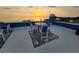 Rooftop deck furnished with a table, four chairs, and an outdoor rug at 228 Shore Dr, Tarpon Springs, FL 34689