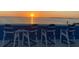 Enjoy breathtaking sunset views from the rooftop seating area with Adirondack chairs at 228 Shore Dr, Tarpon Springs, FL 34689