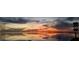 Scenic sunset view over the water with reflections on the water surface at 228 Shore Dr, Tarpon Springs, FL 34689