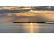 Serene water view with island and reflections during sunset at 228 Shore Dr, Tarpon Springs, FL 34689