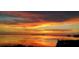 Mesmerizing sunset view over the water with vibrant colors painting the sky at 228 Shore Dr, Tarpon Springs, FL 34689