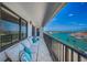 Enjoy water views from this condo's expansive balcony featuring comfortable seating and room for entertaining at 240 Sand Key Estates Dr # 58, Clearwater Beach, FL 33767