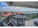 Enjoy sunset views from this condo's spacious balcony with comfortable seating and ample space at 240 Sand Key Estates Dr # 58, Clearwater Beach, FL 33767