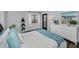 Bright bedroom featuring stylish decor, wood look floors and light blue walls at 240 Sand Key Estates Dr # 58, Clearwater Beach, FL 33767