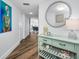 Hallway with modern coastal decor, leading to a dining area at 240 Sand Key Estates Dr # 58, Clearwater Beach, FL 33767