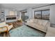 Stylish living room with hardwood floors, a fireplace, and stunning water views at 240 Sand Key Estates Dr # 58, Clearwater Beach, FL 33767