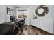 Bright office with a dark desk, modern white credenza, decorative mirror, and a view at 240 Sand Key Estates Dr # 58, Clearwater Beach, FL 33767
