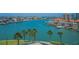 Scenic water view showcasing beautiful waterfront homes, boat docks, and lush tropical landscaping at 240 Sand Key Estates Dr # 58, Clearwater Beach, FL 33767