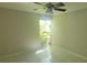 Bright and airy bedroom with a ceiling fan and a large window bringing in natural light at 2424 W Tampa Bay Blvd # A106, Tampa, FL 33607