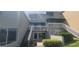 Exterior view of a multi-story waterfront condo building with well-maintained landscaping at 2424 W Tampa Bay Blvd # A106, Tampa, FL 33607