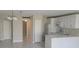 Bright kitchen featuring white cabinetry, modern appliances, and tile flooring at 2424 W Tampa Bay Blvd # A106, Tampa, FL 33607