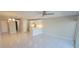 Open-concept living room with tile flooring, updated lighting, and a modern kitchen at 2424 W Tampa Bay Blvd # A106, Tampa, FL 33607