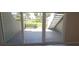 Exterior patio view through sliding glass door with waterfront views and stairs nearby at 2424 W Tampa Bay Blvd # A106, Tampa, FL 33607