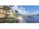Scenic waterfront views with a swing, docks, and lush landscaping surrounding the condo at 2424 W Tampa Bay Blvd # A106, Tampa, FL 33607