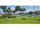 Beautiful waterfront view with lush palm trees, boat docks, and serene water setting at 2424 W Tampa Bay Blvd # A106, Tampa, FL 33607
