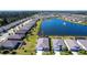Overhead view of home with pool, pond, and well-kept community at 25317 E Lenox Cir, Punta Gorda, FL 33950