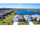 Aerial view of home with a pond, fountain, and beautiful neighborhood at 25317 E Lenox Cir, Punta Gorda, FL 33950