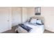 Cozy bedroom featuring a bed, soft carpet and two white doors at 25317 E Lenox Cir, Punta Gorda, FL 33950
