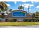 Waterford community entrance sign with lush landscaping under a beautiful blue sky at 25317 E Lenox Cir, Punta Gorda, FL 33950