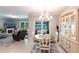 Bright dining area offering views of outdoor space and seamless flow to the living room at 25317 E Lenox Cir, Punta Gorda, FL 33950