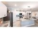 Bright kitchen featuring granite countertops, modern appliances, and an open layout at 25317 E Lenox Cir, Punta Gorda, FL 33950