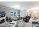 Open living room with water views, comfortable seating, and an adjacent dining area at 25317 E Lenox Cir, Punta Gorda, FL 33950