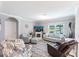 Bright living room with comfortable seating, fireplace, and a view of the water at 25317 E Lenox Cir, Punta Gorda, FL 33950