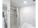 Bright bathroom with a glass-enclosed shower and modern fixtures at 2616 Cove Cay Dr # 301, Clearwater, FL 33760