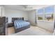 Serene bedroom with a large window offering a beautiful view of the water at 2616 Cove Cay Dr # 301, Clearwater, FL 33760