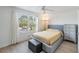 Bedroom features a large window and light, modern floors at 2616 Cove Cay Dr # 301, Clearwater, FL 33760