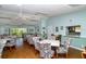 Bright community dining room offers ample seating and a pass-through to the kitchen at 2616 Cove Cay Dr # 301, Clearwater, FL 33760