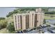 Elevated view of condo building, parking, and bay at 2616 Cove Cay Dr # 301, Clearwater, FL 33760
