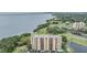 Exterior shot of waterfront condo buildings with expansive views of the bay and a golf course at 2616 Cove Cay Dr # 301, Clearwater, FL 33760