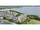 Aerial view of waterfront condo buildings showcasing lush landscaping and bay views at 2616 Cove Cay Dr # 301, Clearwater, FL 33760