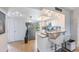 Bright kitchen with granite countertops, stainless steel appliances, and breakfast bar seating at 2616 Cove Cay Dr # 301, Clearwater, FL 33760