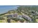 Panoramic aerial view featuring condos, a golf course, a bay, and waterfront views at 2621 Cove Cay Dr # 204, Clearwater, FL 33760