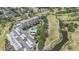 A condo community featuring lush landscaping, a golf course, and waterfront views at 2621 Cove Cay Dr # 204, Clearwater, FL 33760